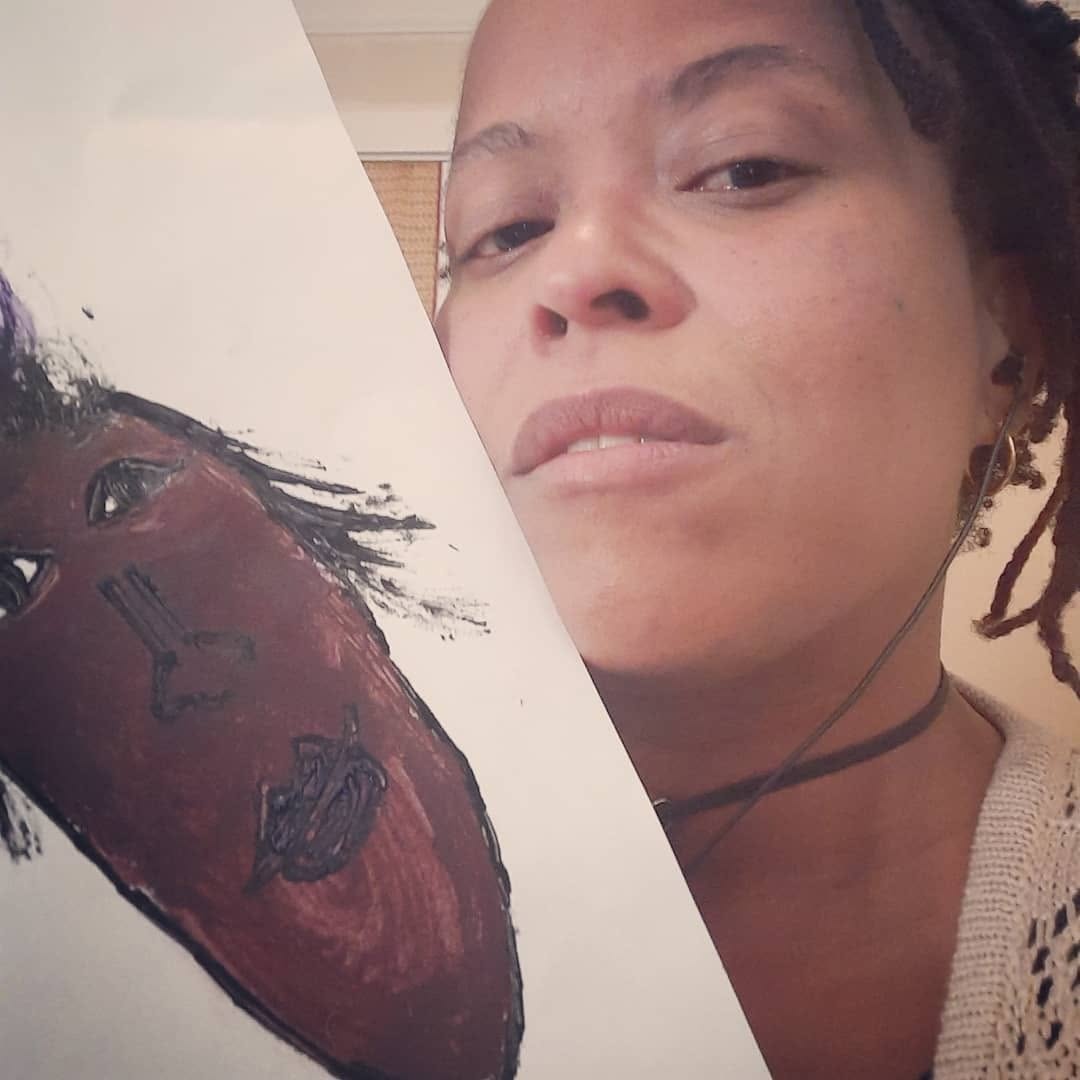 Jianda Monique with one of her paintings